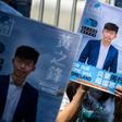 Posters of pro-democracy activist Joshua Wong are placed in front of the Central Government Complex as he announced in September his run for District Council elections in Hong Kong