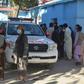 Afghans wait outside a hospital in Kabul for news of friends and family injured in a Taliban attack