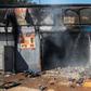 Attacked: The remains of a store in Johannesburg's Malvern area after a night of violence