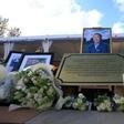 Floral tributes and photographs placed at the Vichai Srivaddhanapraba Memorial Garden in Leicester