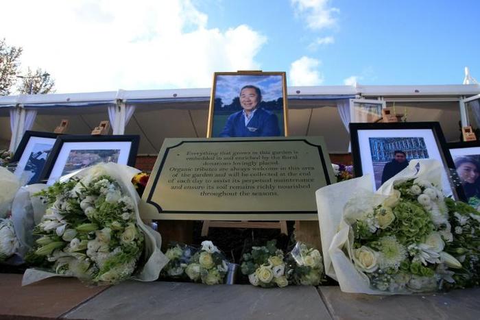 Floral tributes and photographs placed at the Vichai Srivaddhanapraba Memorial Garden in Leicester