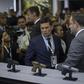 Brazilian Justice Minister Sergio Moro (C) looks at guns during the Latin American Defense and Security exhibition (LAAD 2019) in Rio de Janeiro, Brazil, on April 2, 2019