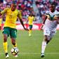 Thapelo Morena (L) of South Africa controls the ball with Lassina Coulibaly of Mali in pursuit