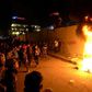 Iraqi demonstrators set fire to tyres outside the Iranian consulate in the holy city of Karbala