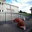 An anti-abortion activist demonstrates outside the pParliament Building in Belfast on Monday