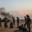 Turkish soldiers and Turkey-backed Syrian fighters on the outskirts of the Syrian city of Manbij near the Turkish border