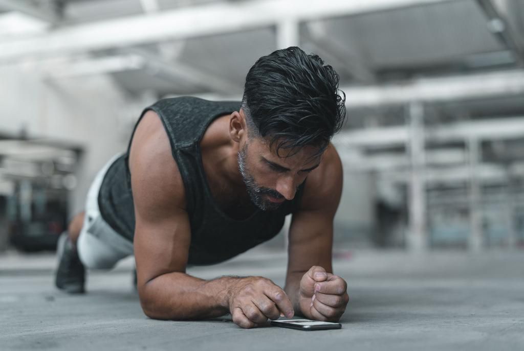 Exercising with a Smart Phone while in Plank Position