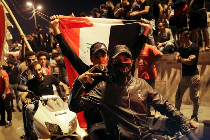 Anti-government demonstrators in Baghdad's Tahrir Square late Thursday