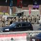 Lebanese soldiers get the traffic flowing again after removing protesters' roadblocks as the government's resignation under pressure from the streets looks set to ease a two-week-old lockdown