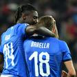 Italy's midfielder Nicolo Barella (C) and Moise Kean (L) scored in either half against Finland