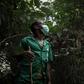 Protector: A ranger dons a facemask to help him follow the tracks of a gorilla, a famously elusive species
