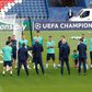 Real Madrid coach Zinedine Zidane talks to his players on the Parc des Princes pitch ahead of Wednesday's Champions League clash with Paris Saint-Germain