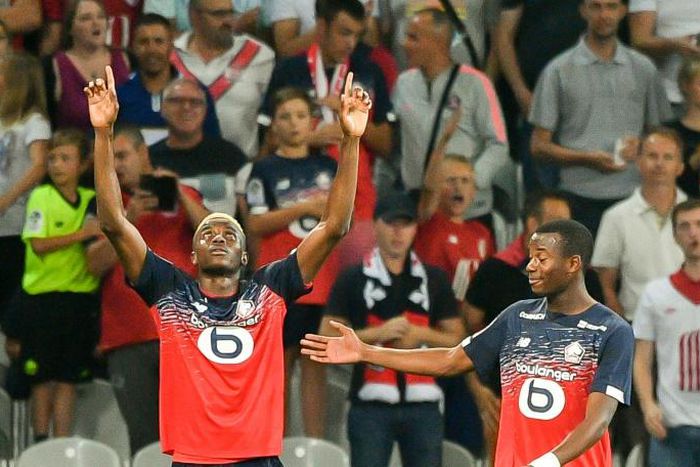 Osimhen (L) celebrates after scoring against Saint-Etienne