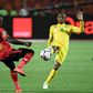 A file photo of Zimbabwe star Khama Billiat (R) playing against Uganda during the 2019 Africa Cup of Nations in Egypt