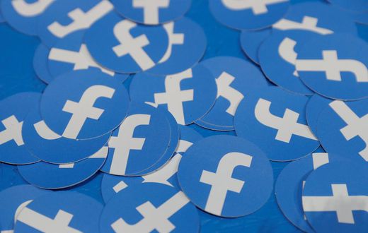 FILE PHOTO: Stickers bearing the Facebook logo are pictured at Facebook Inc's F8 developers conference in San Jose, California, U.S., April 30, 2019.  REUTERS/Stephen Lam/File Photo