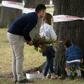 New Zealanders lay flowers near one of the mosques targeted in Friday's deadly attack