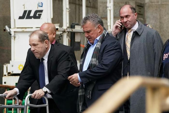 Disgraced Hollywood mogul Harvey Weinstein leaves a court hearing in New York using a walking frame