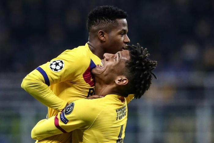 Seventeen-year-old Barcelona forward Ansu Fati (Top) celebrates after becoming the youngest player to score in the Champions League.