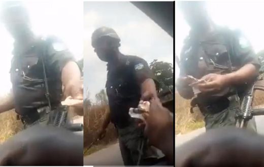 Police officer gives change to driver after taking bribe (video)