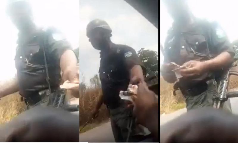 Police officer gives change to driver after taking bribe (video)