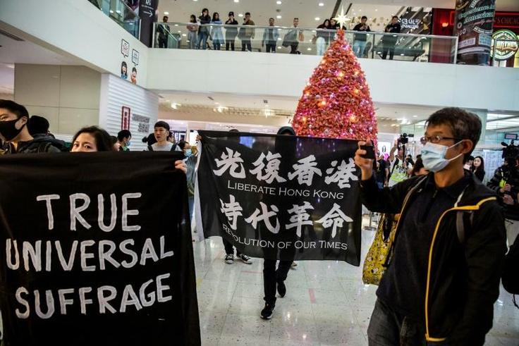 Protesters unfurled banners in shopping malls across Hong Kong