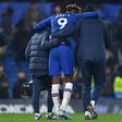 Chelsea striker Tammy Abraham (centre) is helped off of the pitch at Stamford Bridge
