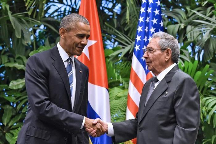 Carlos Fernandez de Cossio, Havana's top diplomat in charge of relations with Washington, recalls the "emotional moment" and hope in Cuba after US President Barack Obama (L) and his Cuban counterpart Raul Castro (R), agreed to revive diplomatic ties