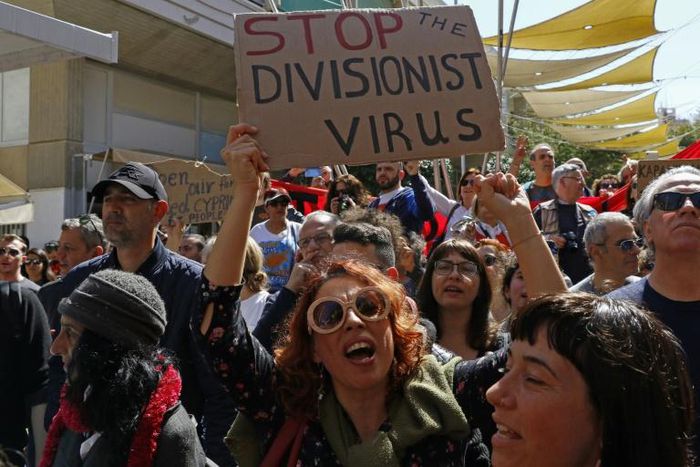The closure of crossings on the divided island of Cyprus over fears of the spread of coronavirus has sparked angry protests