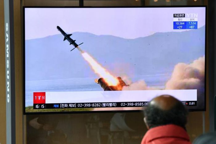 A man in a Seoul railway station watches a television broadcast on April 14, 2020, showing file footage of a North Korean missile test, after Pyongyang launched several suspected short-range cruise missiles toward the sea