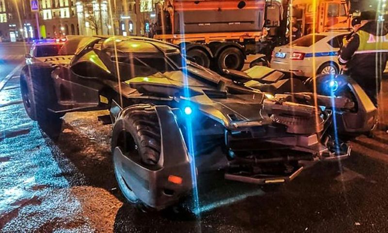 This handout photo from Russian Interior Ministry taken on February 22, 2020 shows Russian traffic policemen standing next to a vehicle in Moscow that bears a striking resemblance to the "Batmobile"