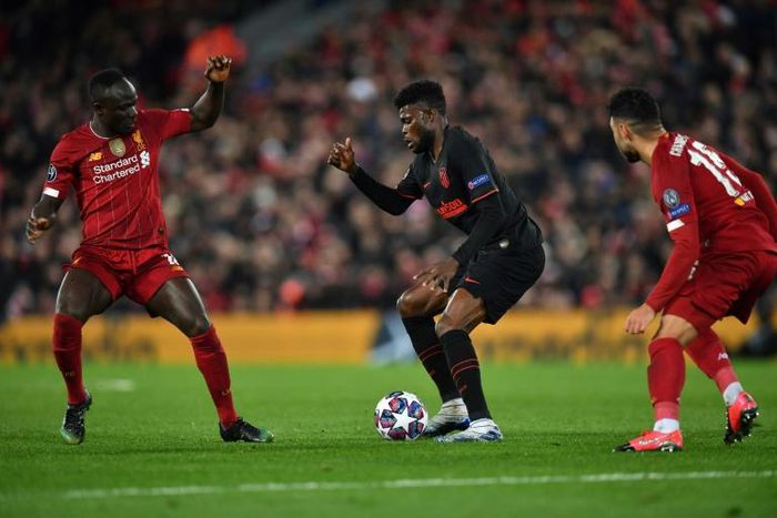 Senegalese Sadio Mane (L) of Liverpool and Ghanaian  Thomas Partey (C) of Atletico Madrid are among the stars set to light up the 2021 Africa Cup of Nations in Cameroon