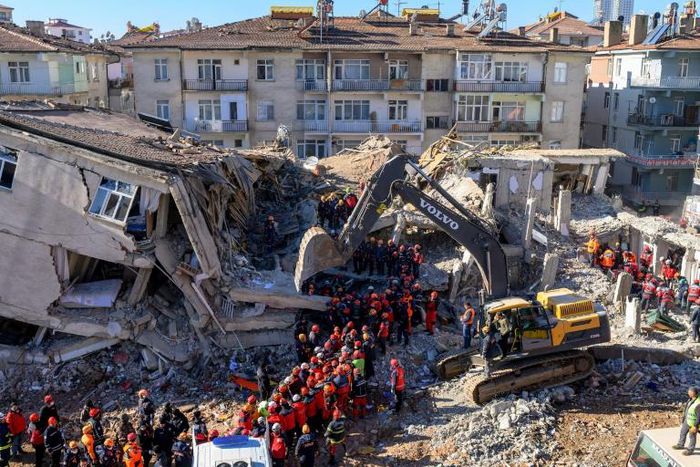 Nearly 4,000 rescue workers combed through debris in freezing temperatures, helped by mechanical diggers, in vain hopes of finding anyone alive