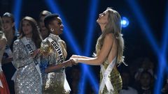 Miss South Africa Zozibini Tunzi (L) and Miss Puerto Rico Madison Anderson (R), the two finalists, wait to hear the winner's name on stage during the 2019 Miss Universe pageant at the Tyler Perry Studios in Atlanta, Georgia
