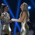 Miss South Africa Zozibini Tunzi (L) and Miss Puerto Rico Madison Anderson (R), the two finalists, wait to hear the winner's name on stage during the 2019 Miss Universe pageant at the Tyler Perry Studios in Atlanta, Georgia