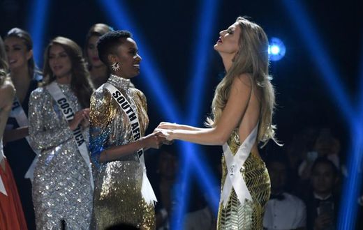 Miss South Africa Zozibini Tunzi (L) and Miss Puerto Rico Madison Anderson (R), the two finalists, wait to hear the winner's name on stage during the 2019 Miss Universe pageant at the Tyler Perry Studios in Atlanta, Georgia