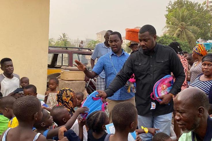 John Dumelo donates hundreds of school bags, exercise books to kids