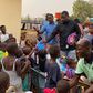 John Dumelo donates hundreds of school bags, exercise books to kids