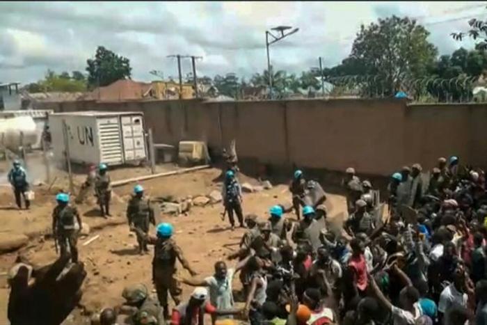 An angry crowd confronted peacekeepers at a UN compound on the outskirts of Beni on Monday. Local people accuse the UN mission in DR Congo of failing to protect them against the notorious ADF militia
