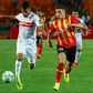 Mohamed Ounajem (L) of Zamalek attacks with Ilyes Chetti of Esperance in pursuit