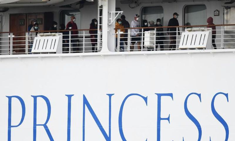 Passengers on the Diamond Princess are confined to their cabins except for brief outings on open decks wearing facemasks