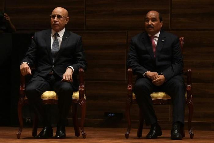 Former president Mohamed Ould Abdel Aziz, right, and his successor, Mohamed Ould Cheikh El Ghazouani