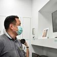 Health Minister Anutin Charnvirakul views closed circuit video images at Bamrasnaradura Infectious Disease Institute in Nonthaburi outside Bangkok where patients infected with the SARS-like virus are confined
