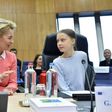Greta Thunberg (R) calls the climate law championed by European Commission President Ursula von der Leyen (L) insufficient, or in her words, "surrender"