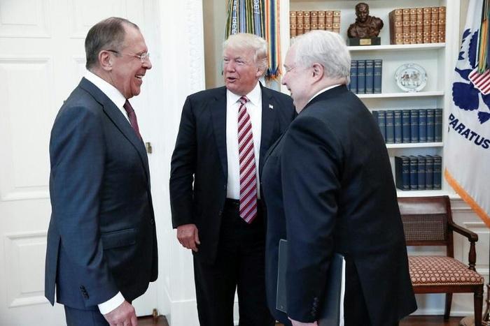 A handout photo made available by the Russian Foreign Ministry on May 10, 2017 shows US President Donald J. Trump (C) speaking with Russian Foreign Minister Sergei Lavrov (L) and then Russian Ambassador to the US Sergei Kislyak during a meeting at the ...