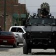 Police patrol after nine people were killed in the La Huertas neighborhood of Tlaquepaque, Mexico