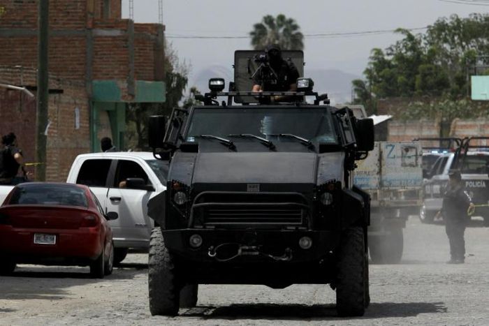 Police patrol after nine people were killed in the La Huertas neighborhood of Tlaquepaque, Mexico