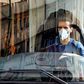 A Tehran bus driver wearing a protective mask as a precaution against coronavirus