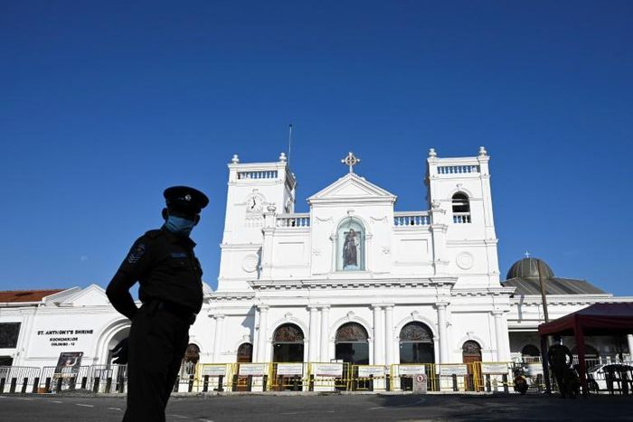 A policeman stands guard outside St. Anthony's church, which was hit by the 2019 Easter suicide bombers