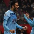 Jay Rodriguez (R) celebrates scoring Burnley's second goal at Manchester United