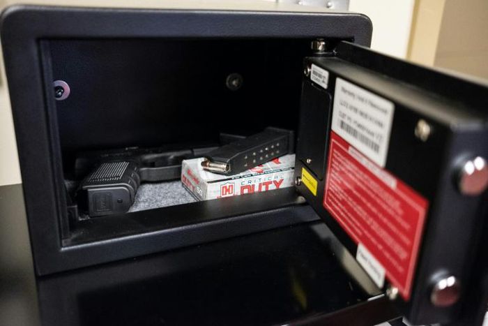 Guns in fingerprint-activated safes are placed in designated classrooms around Sidney High School in the US state of Ohio for a response team of teachers to use in case of an active shooter